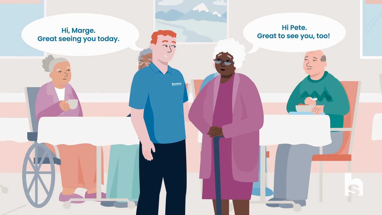 Animated caregiver greeting an elderly resident in an HCSG facility dining area