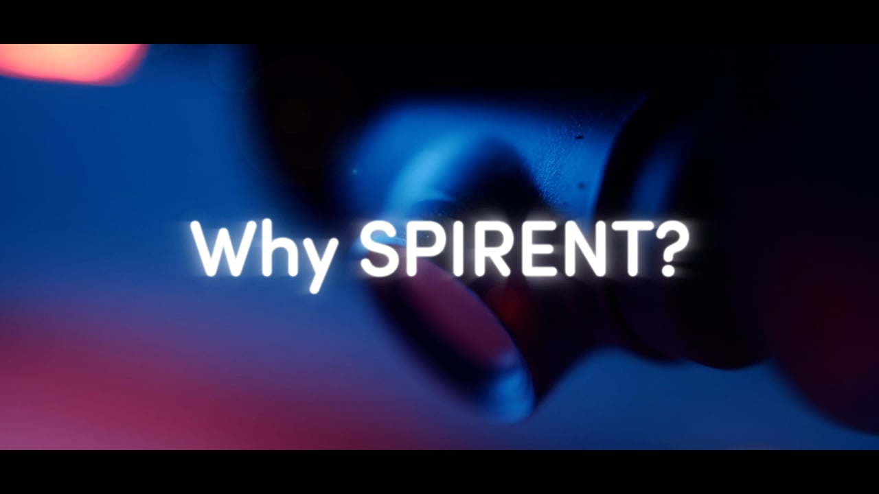 "Why SPIRENT?" title card from a Motifmotion brand explainer video, over a cinematic blue-lit close-up