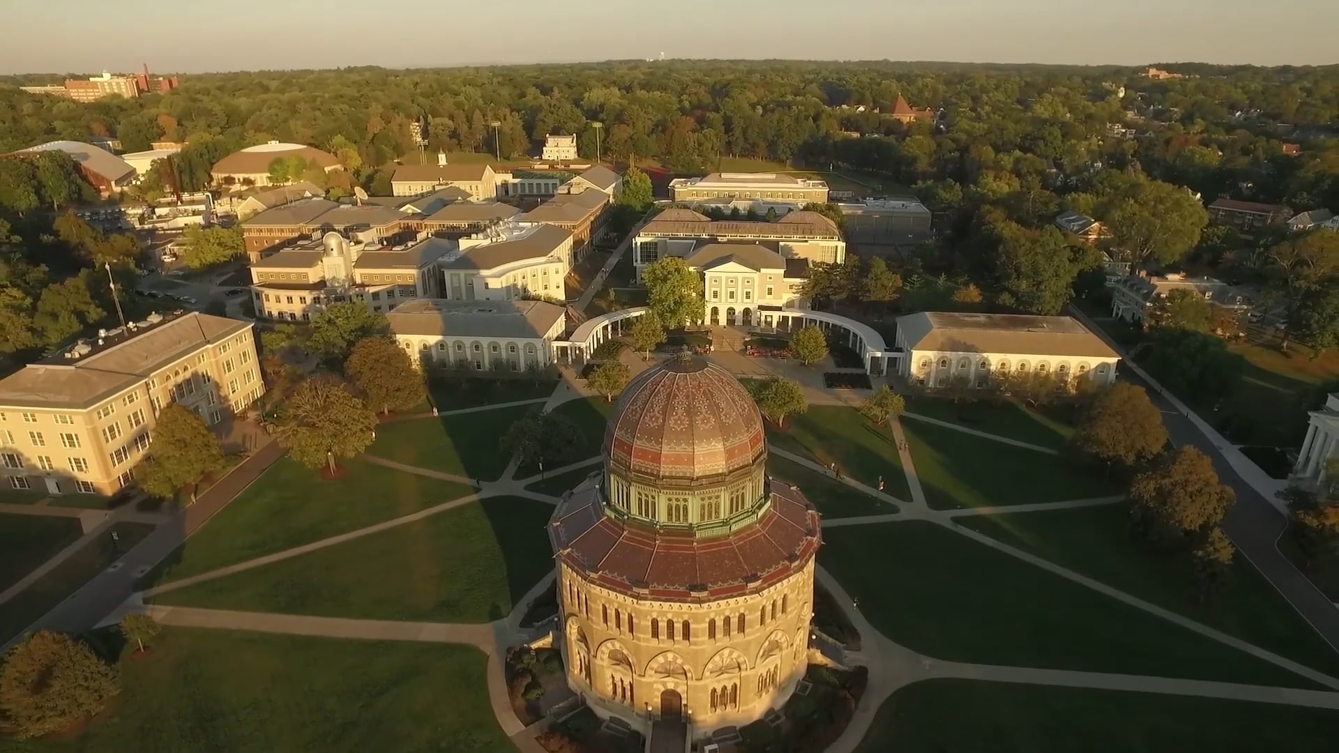 Aerial view of Union College campus at golden hour, with the Nott Memorial dome in the foreground